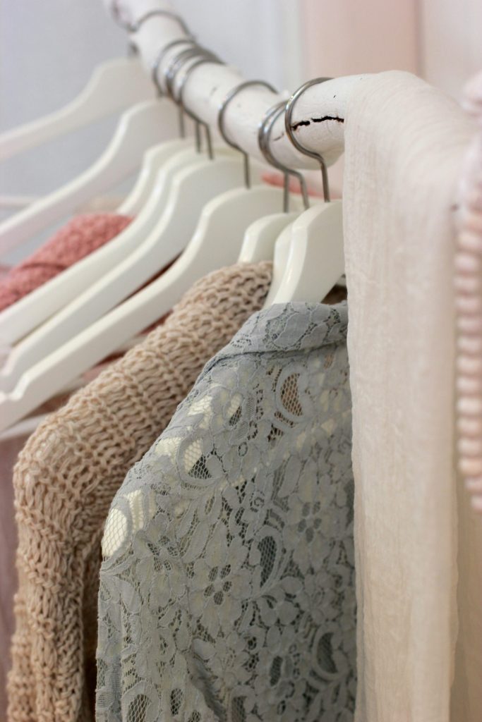 Close-up of lace and knit clothing hanging