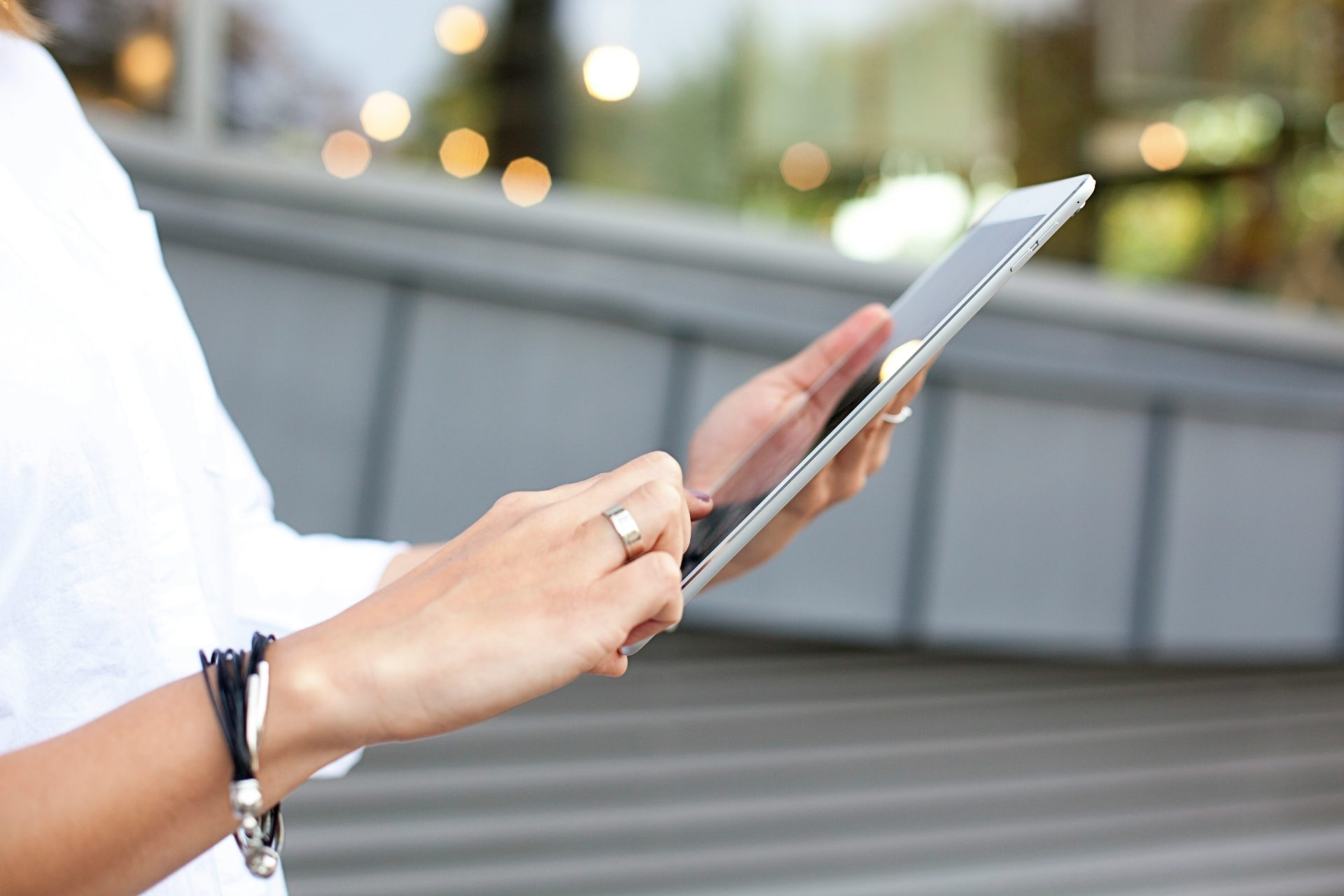 Person using a tablet with two hands.