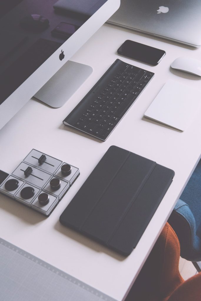 Assorted tech gadgets neatly arranged on desk