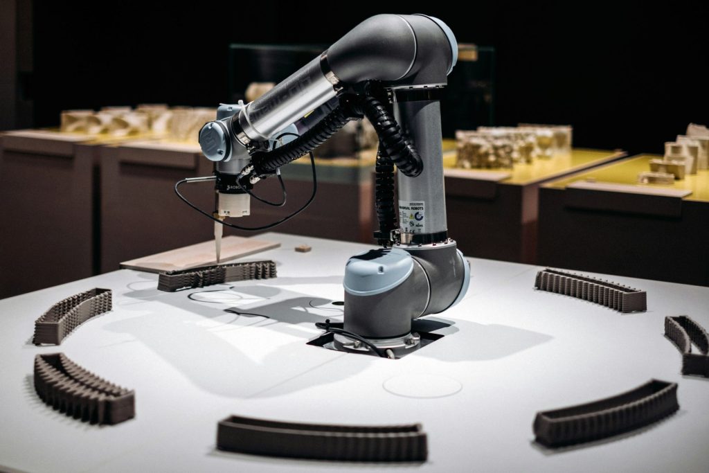 Robotic arm assembling small components on table